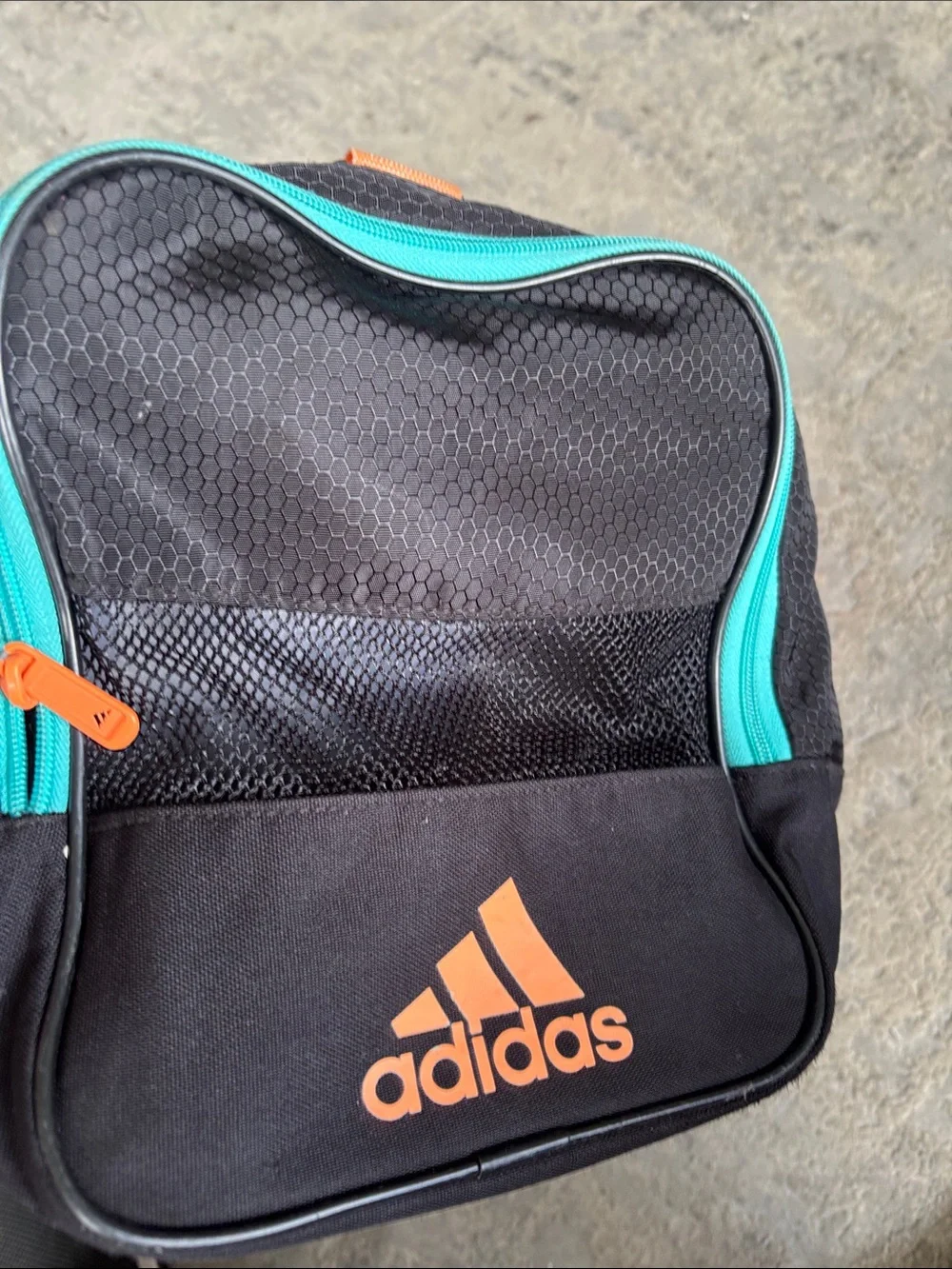 adidas Black Duffel Bag with Teal Zippers and Orange Logo